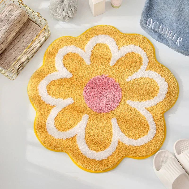 Yellow flower-shaped kawaii rug with a pink center on a light gray floor.