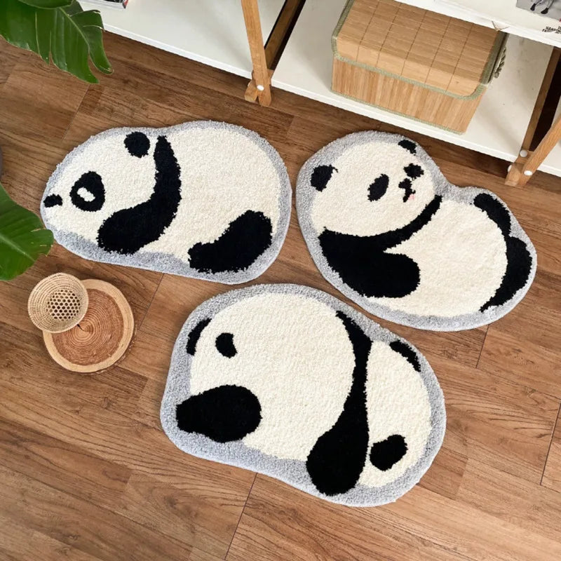 Three panda-shaped kawaii rug on a wooden floor