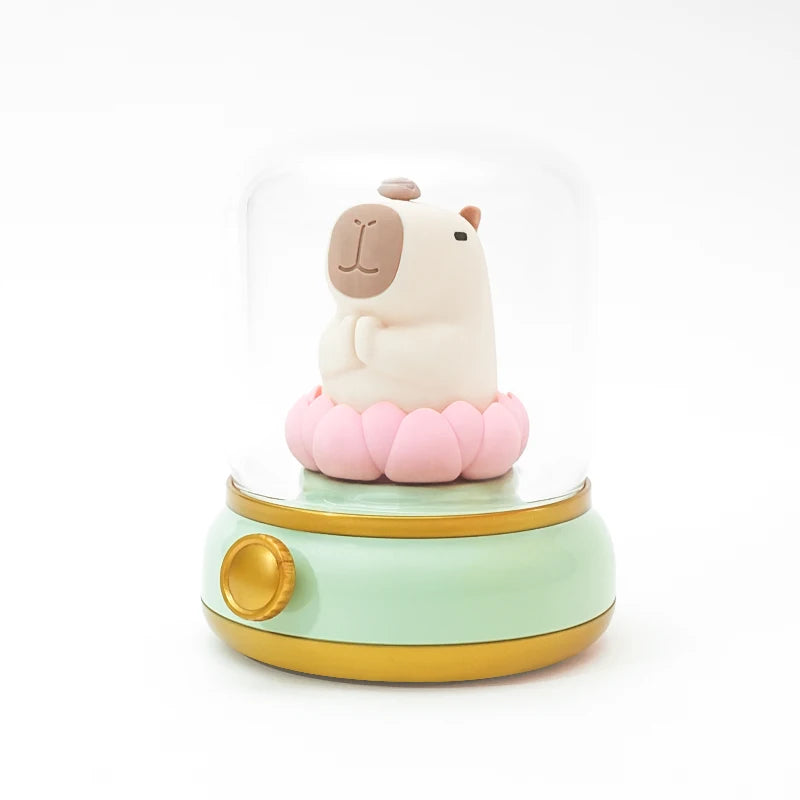 Small figurine of a llama on a pink kawaii flower with a green base on a white background