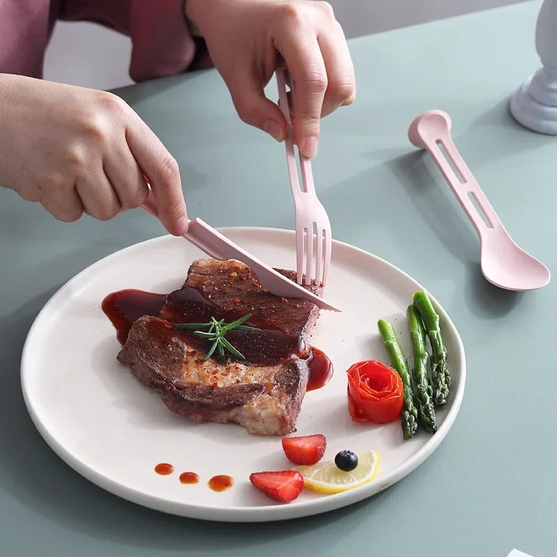 Someone eating food with a set of pink kawaii utensils