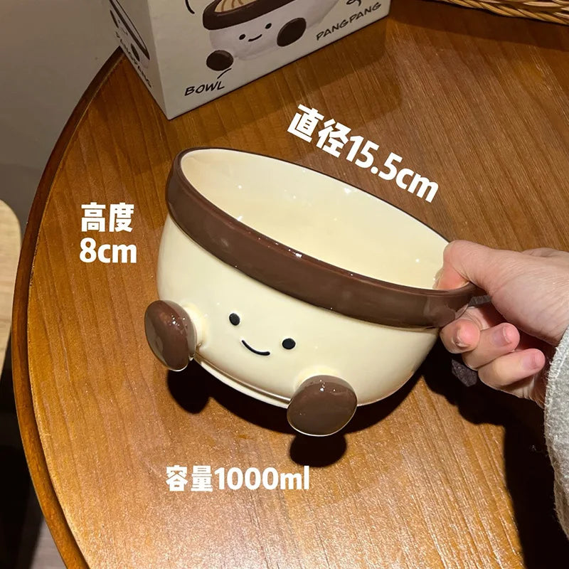 A white cartoon kawaii bowl being held by a person
