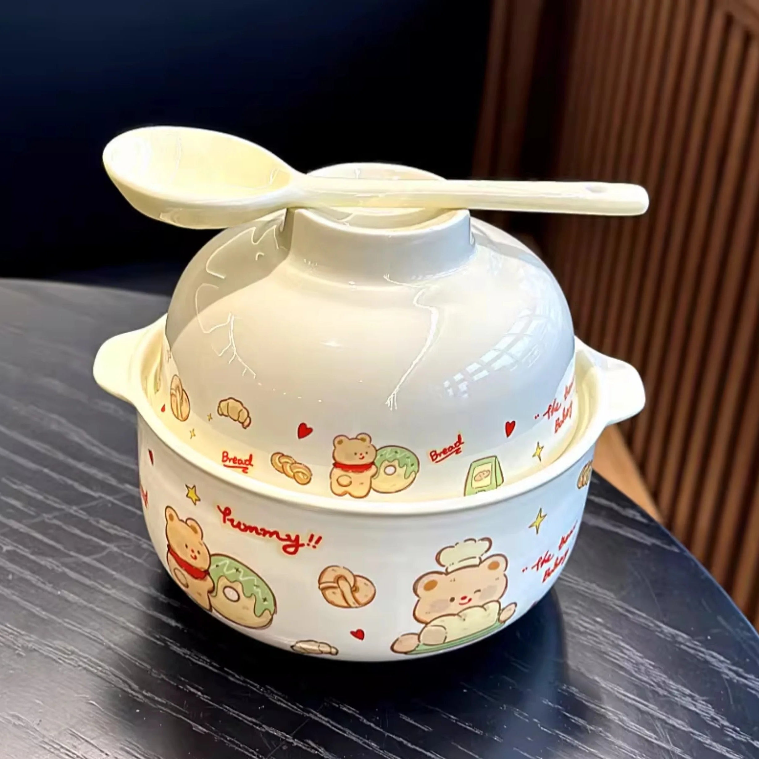 A cartoon bear themed kawaii ramen bowl with a spoon on top