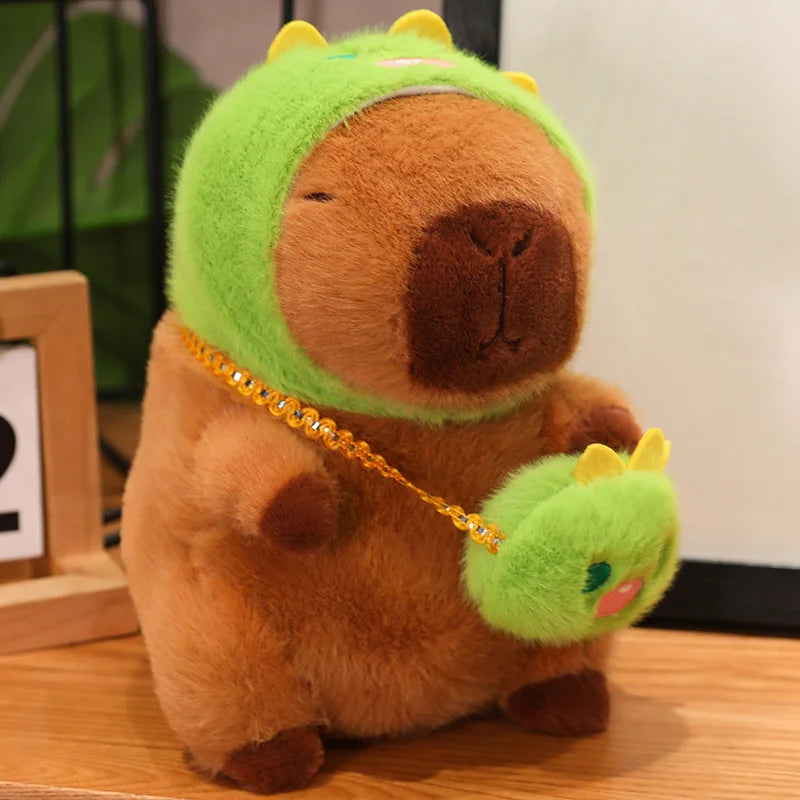Kawaii plush toy resembling a bear with a green dinosaur head and tail on a wooden surface.