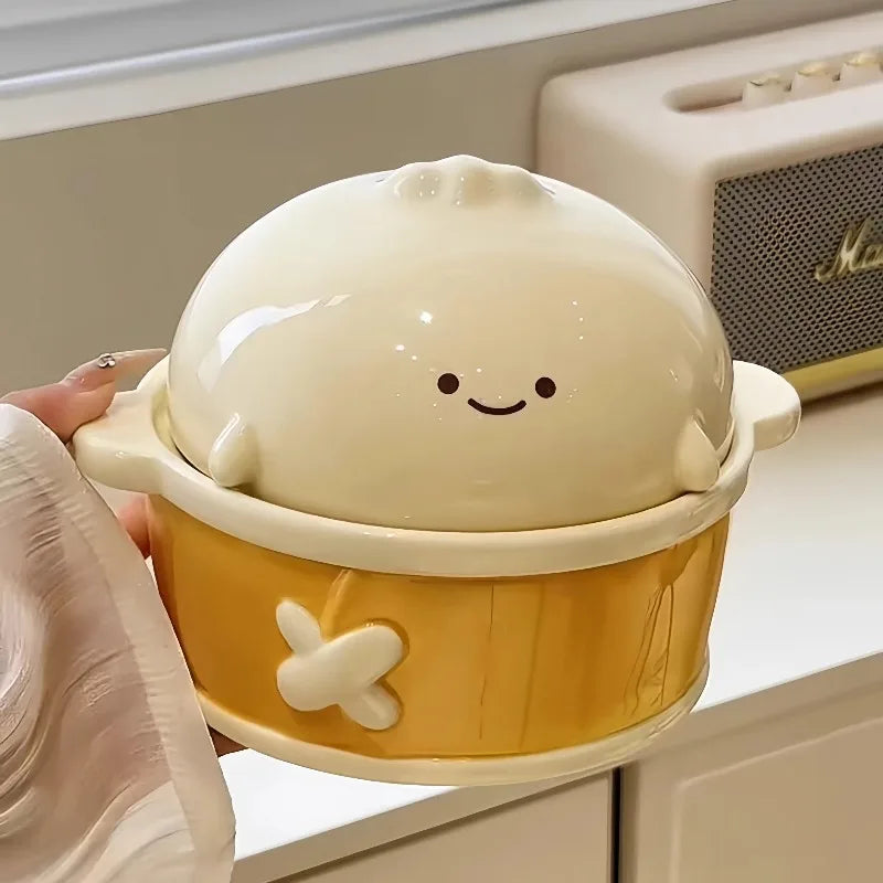 A hand holding a cute smiley kawaii ramen bowl