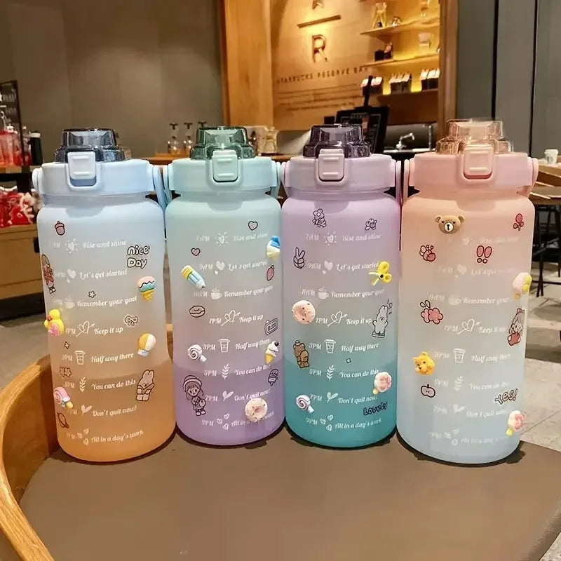 Four colorful kawaii water bottles with cartoon designs on a table in a cafe setting.
