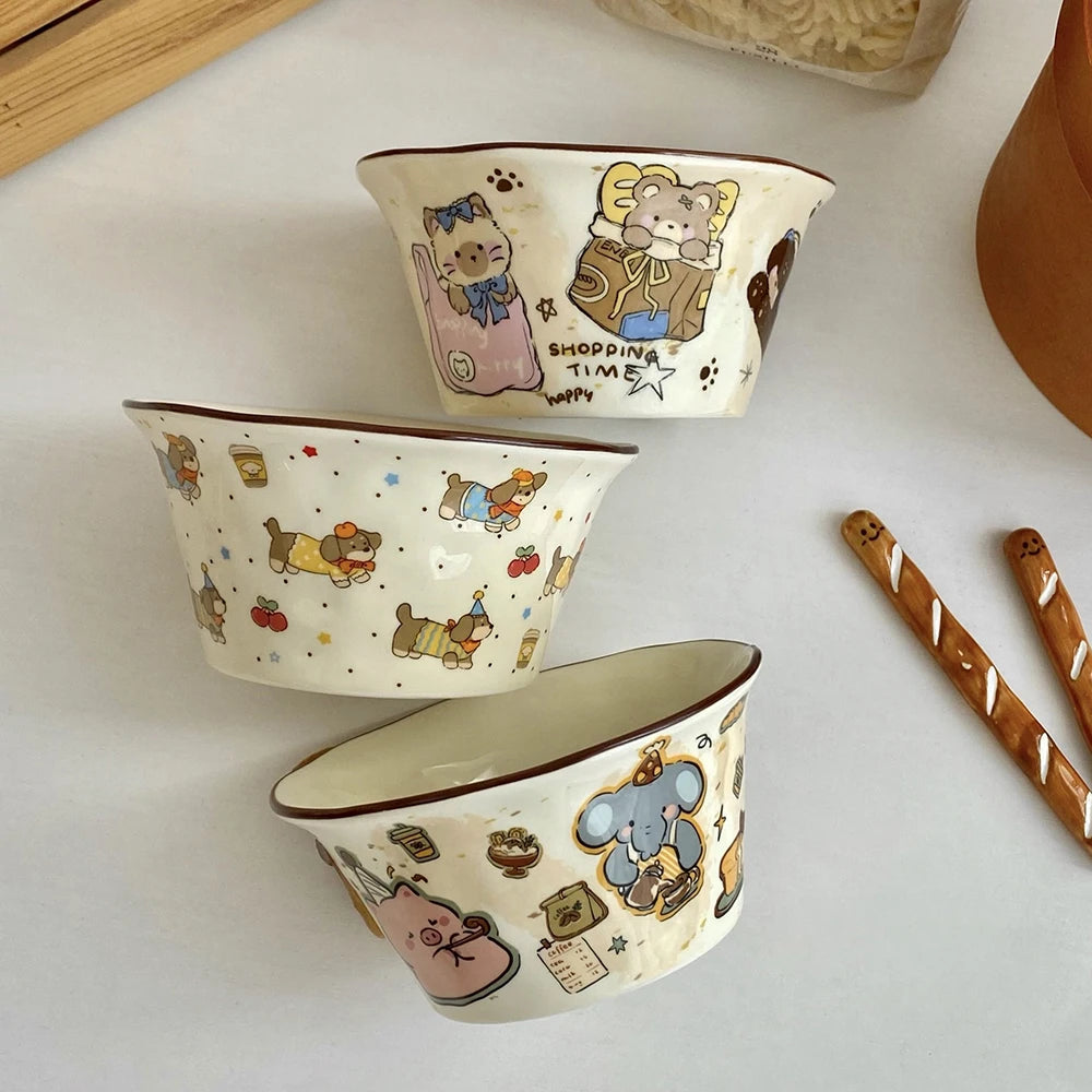Three ceramic kawaii ramen bowls with cartoon bear designs on a white surface.