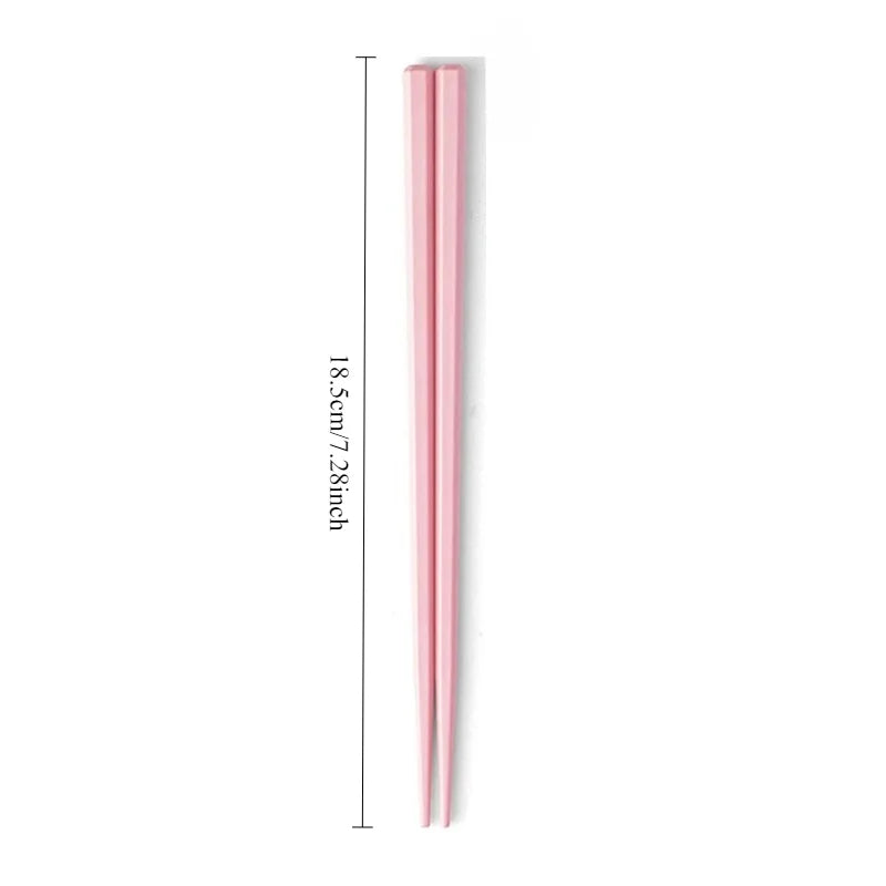 Pink kawaii chopsticks on a white background