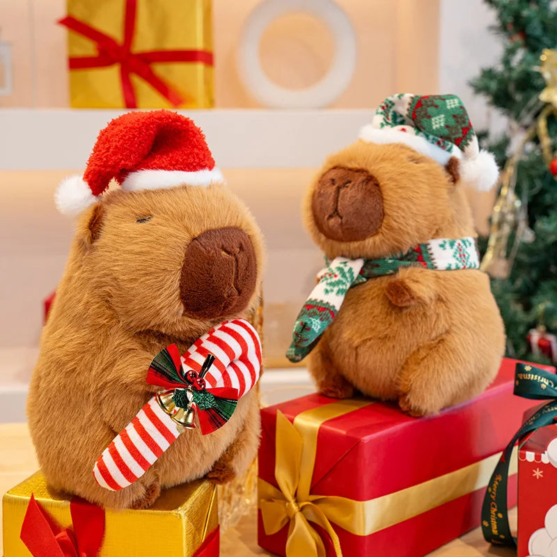 Two kawaii teddy bears in festive attire on Christmas presents with a decorated tree in the background.