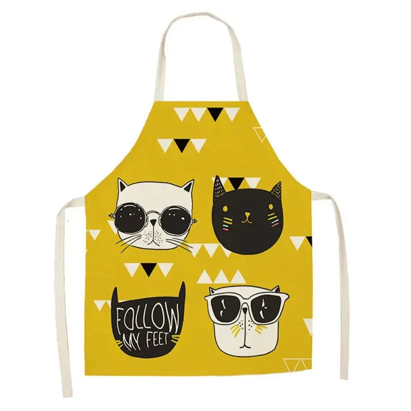 Yellow apron with Kawaii cat illustrations and text on a white background