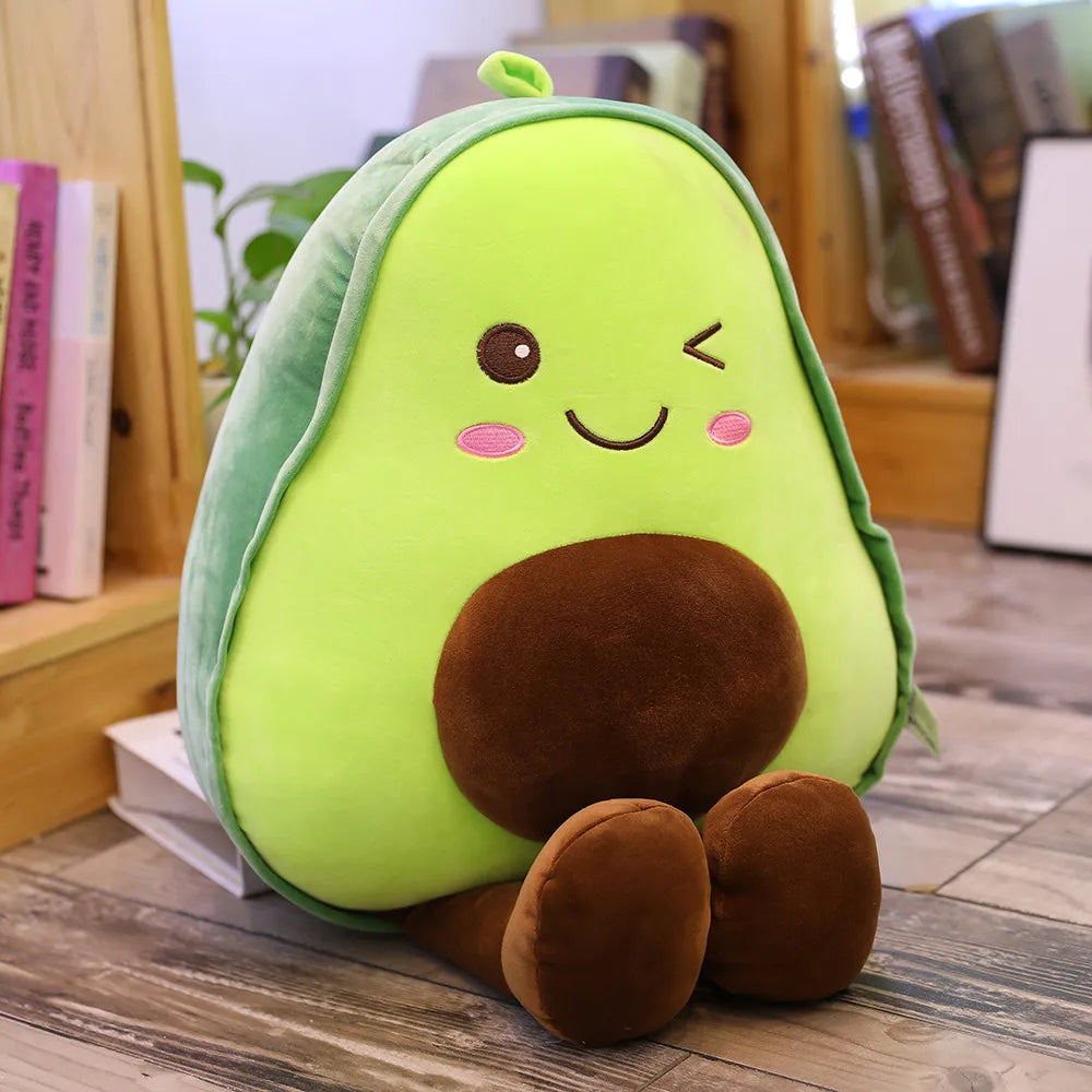 Kawaii plush avocado toy with a smiling face on a wooden surface