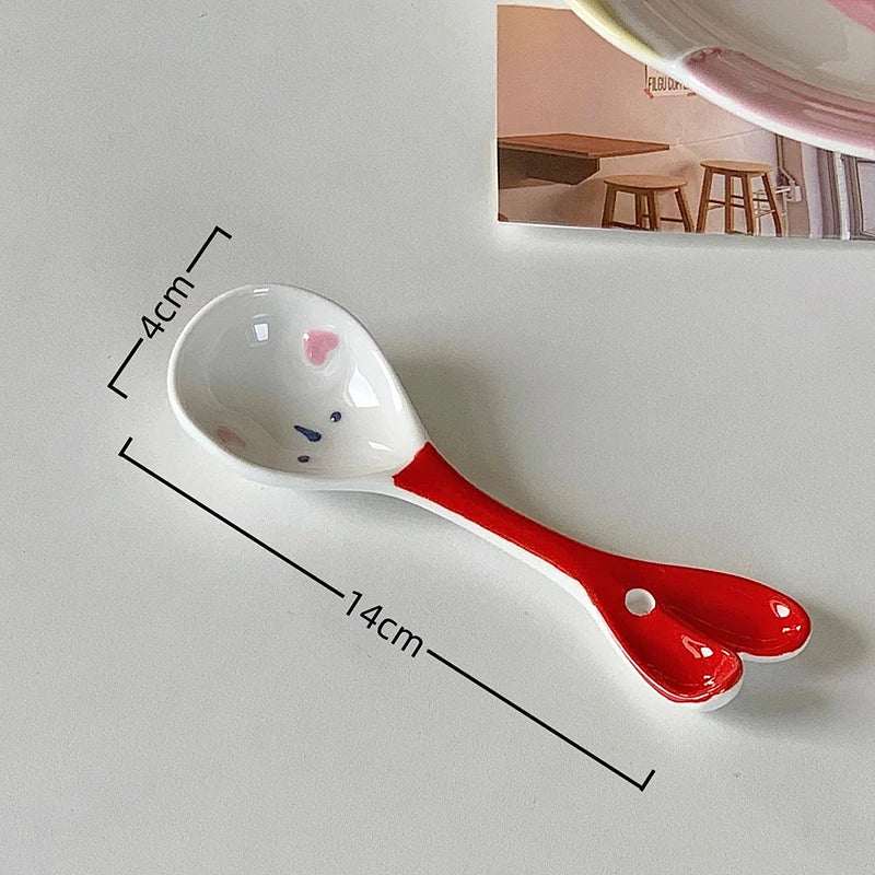 A white ceramic kawaii spoon on a table