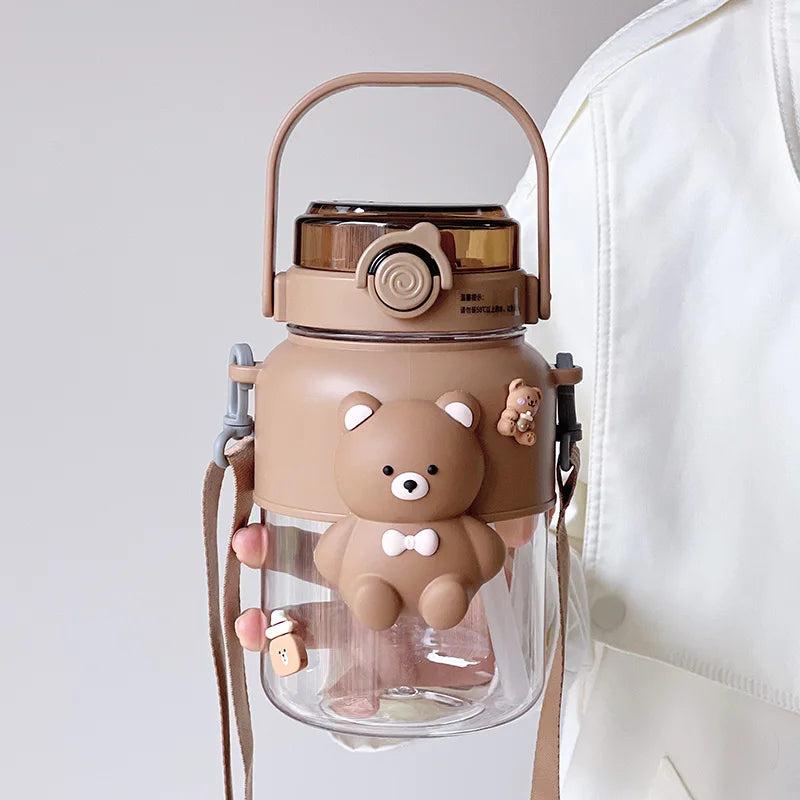 Bear-shaped kawaii water bottle with a clear body and brown accents on a light background