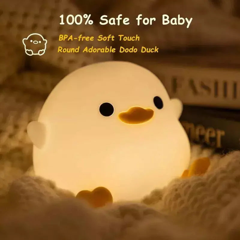 Round, soft-touch duck-shaped kawaii night light with text indicating safety for babies.