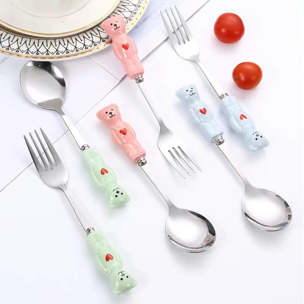 Set of kawaii utensils with bear-shaped handles on a white background