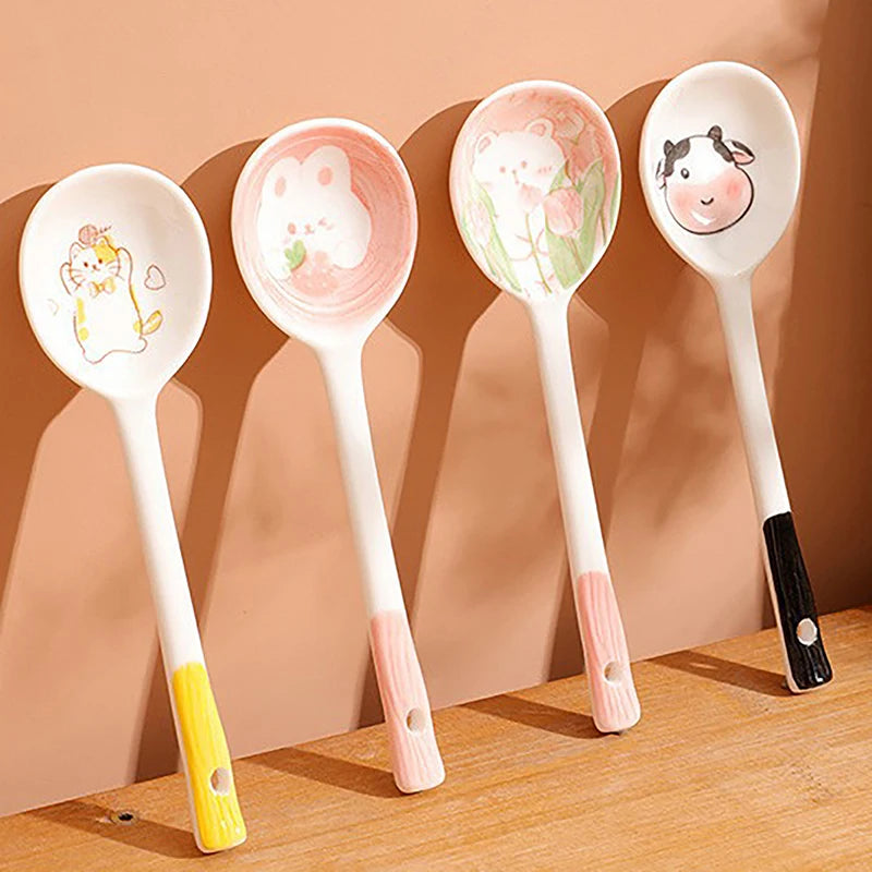 A set of four kawaii spoons propped up against the wall