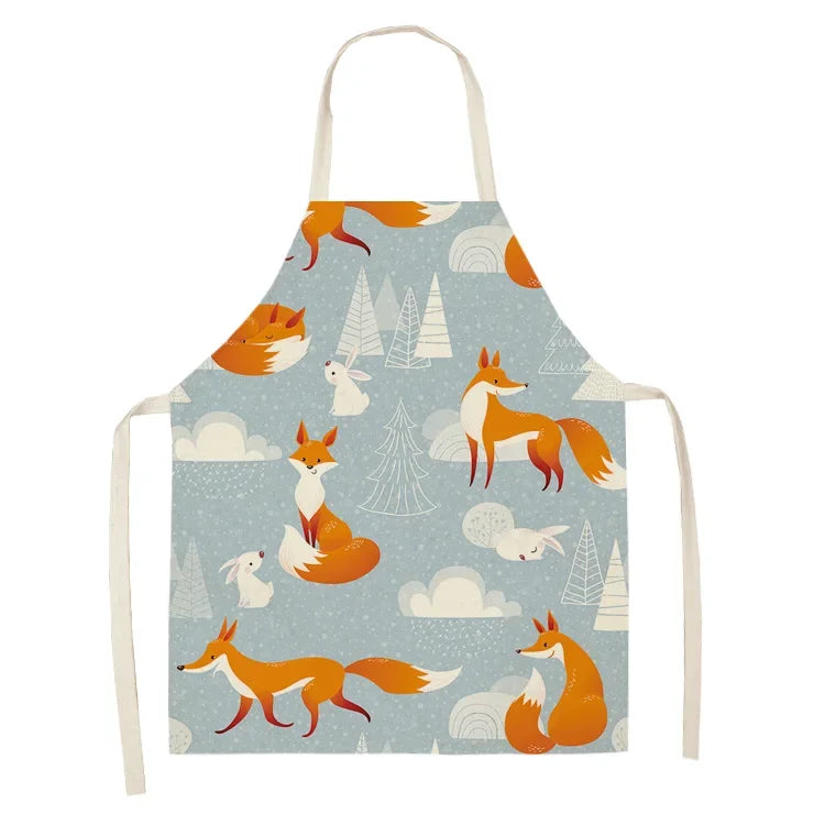 Children's kawaii apron with fox and forest pattern on a light blue background