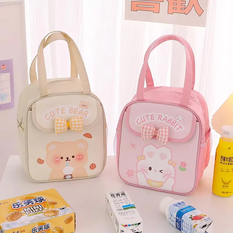 Two small kawaii bags, one beige with a bear design and one pink with a rabbit design, on a surface with snacks.