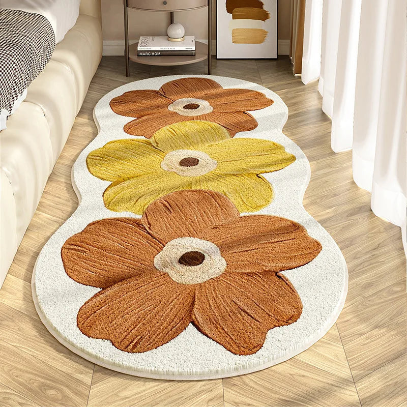 Floral-patterned kawaii rug on a wooden floor with a couch and decor items in the background