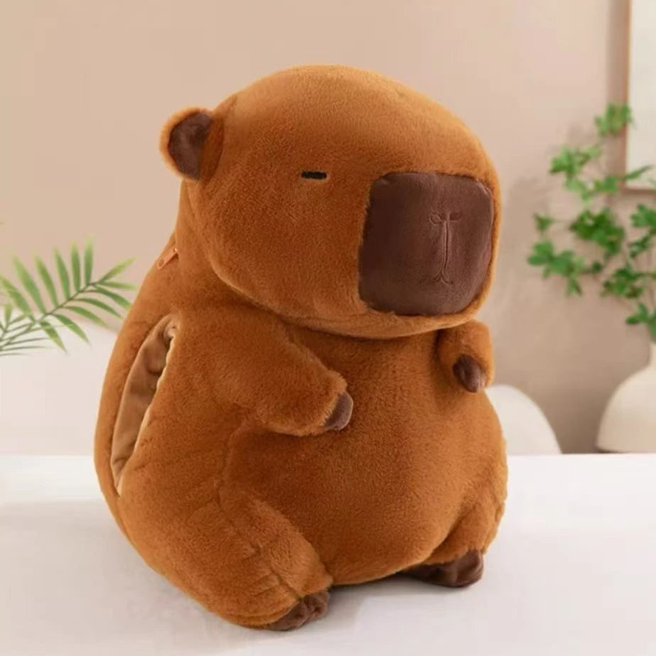 Brown kawaii plush toy resembling a beaver on a white surface with a neutral background