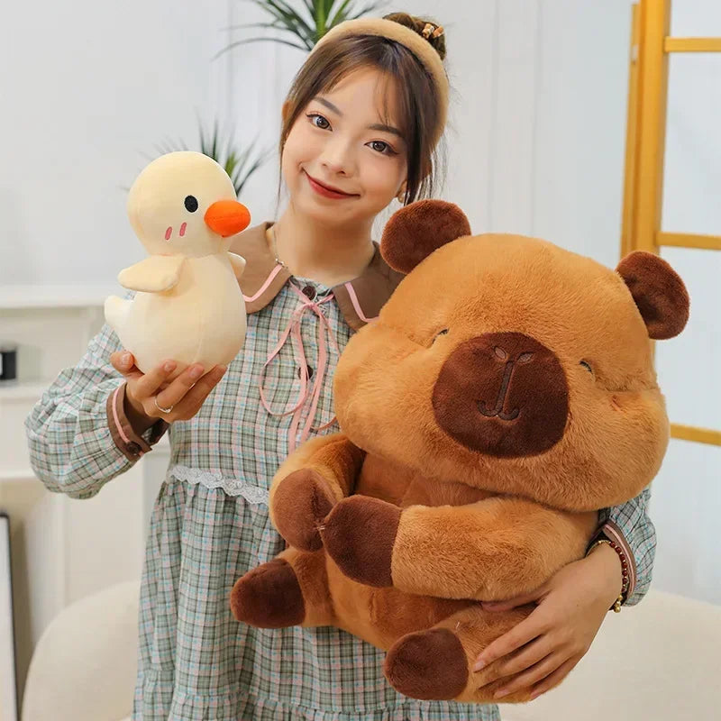 Woman holding a kawaii plush duck and a plush bear in a home setting
