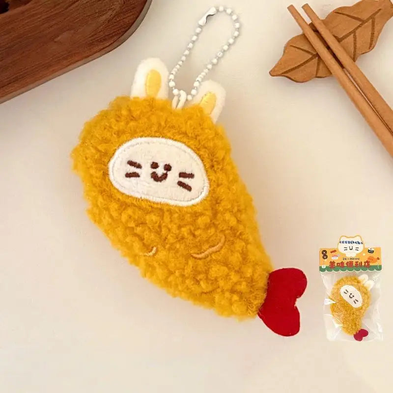 Yellow kawaii plush keychain with a face on a light surface