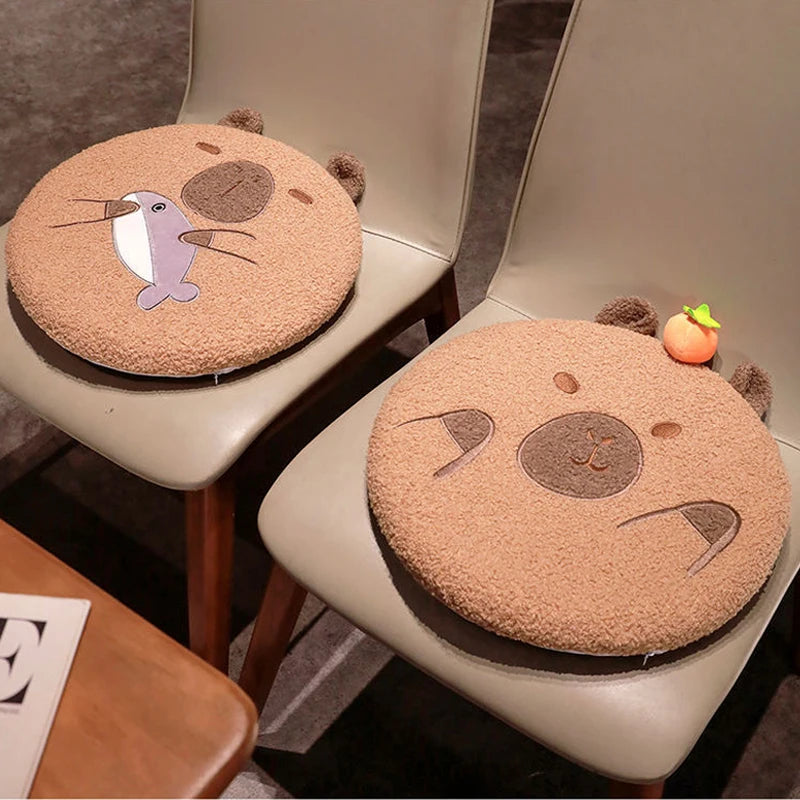 Two round animal-themed kawaii seat covers on chairs with a neutral background.