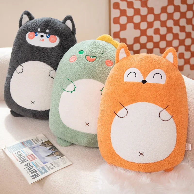 Three cartoon-style plush kawaii cushions shaped like animals on a couch with a newspaper.