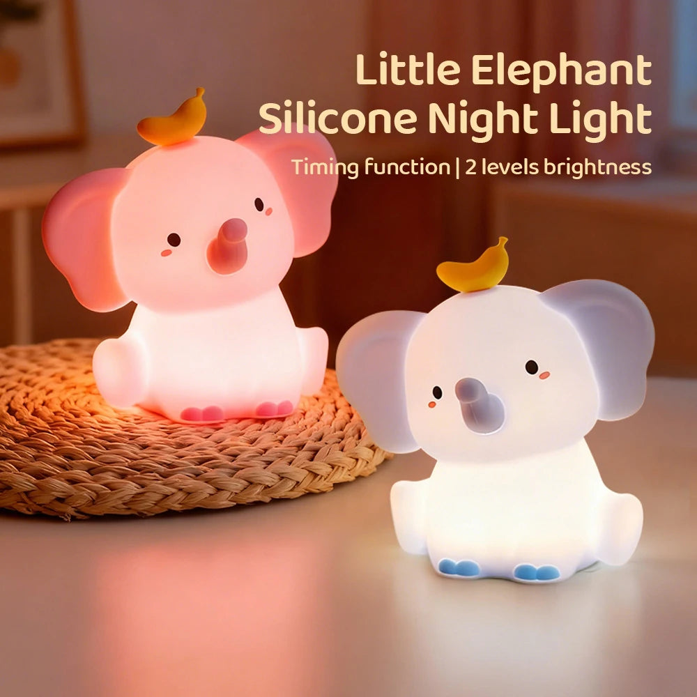 Two elephant-shaped silicone kawaii night lights on a textured surface with text indicating features.