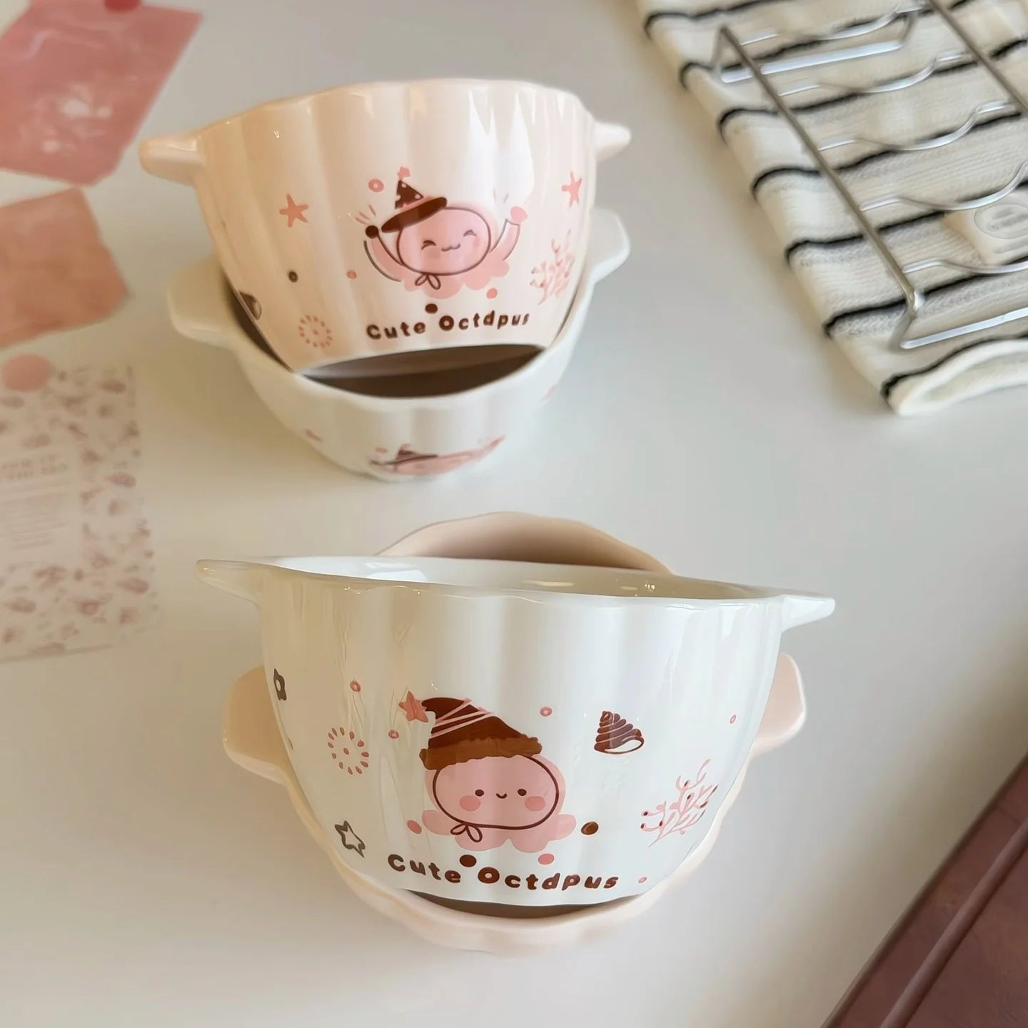 Two pumpkin shaped kawaii ramen bowls next to each other on the table