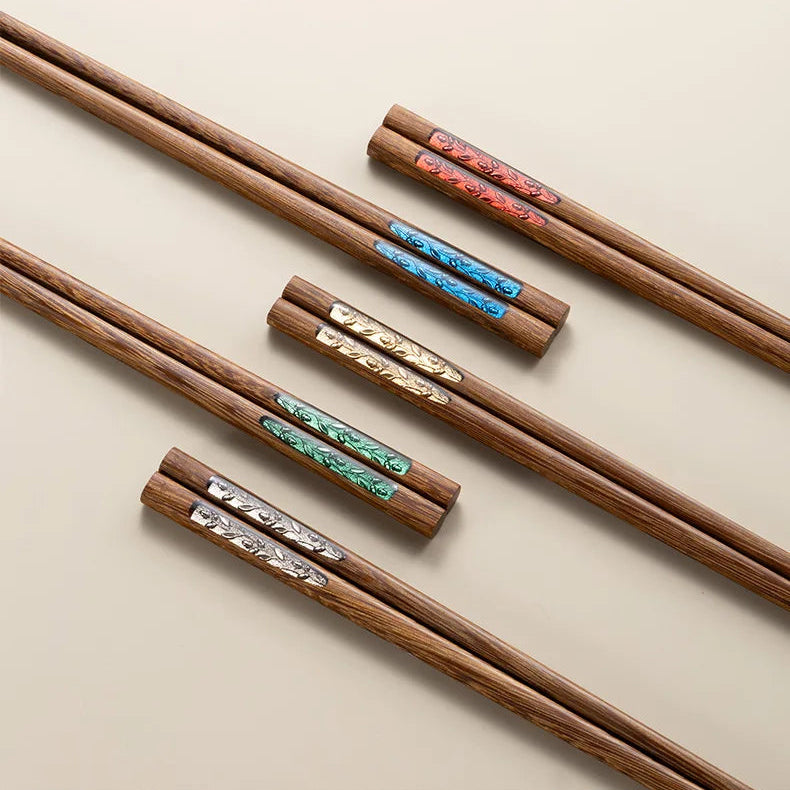 Wooden kawaii chopsticks with color swatches on a beige background