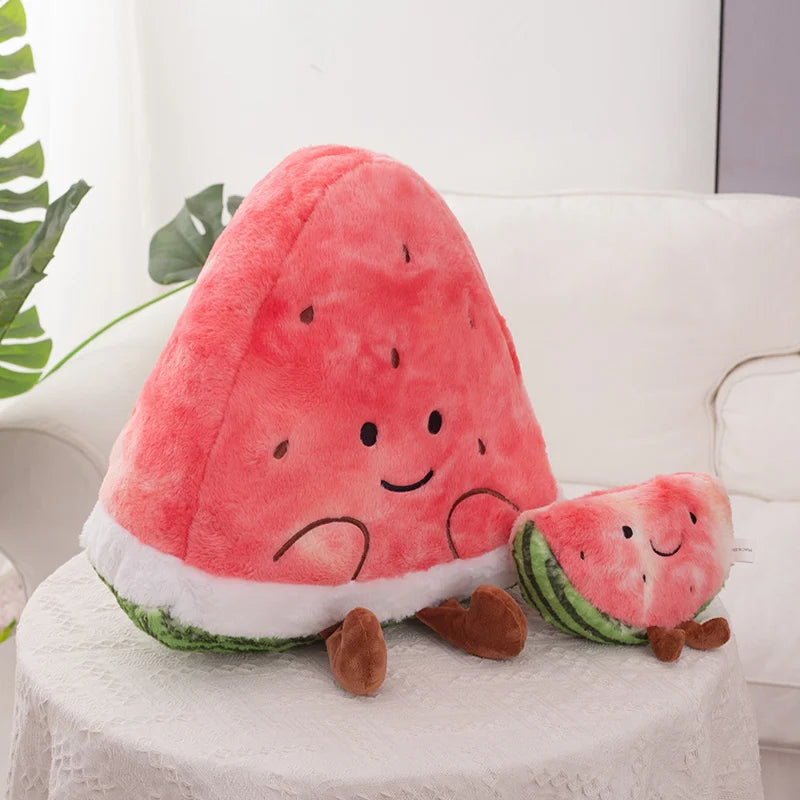 Kawaii plush watermelon toy with a smaller plush slice on a white surface.