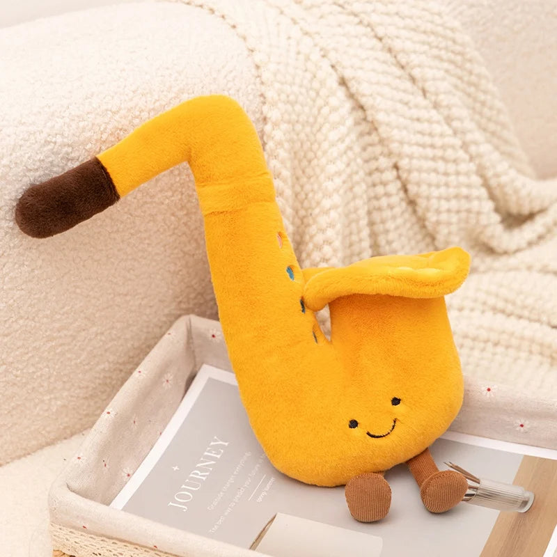 Yellow kawaii plush toy with a long neck on a white surface with a textured beige background