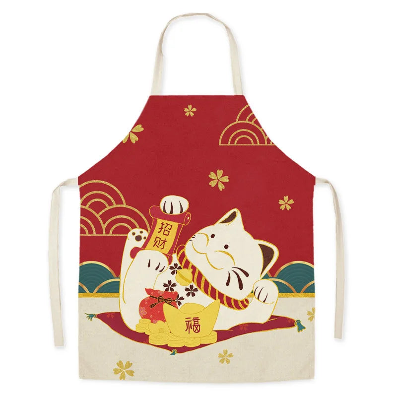 Red kawaii apron with a white cat design holding a banner on a white background