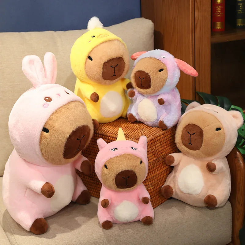 Set of kawaii plush toys resembling animals in costumes on a couch.