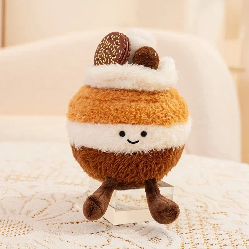 Kawaii plush toy resembling a s'more with a smiling face on a textured surface.