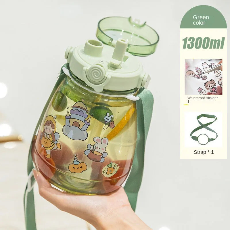 Children's kawaii water bottle with cartoon designs held by a hand, on a light gray background.