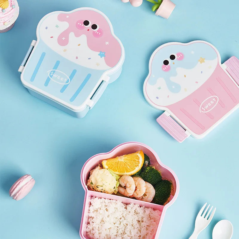 Kawaii-themed kawaii bento box with food on a light blue background