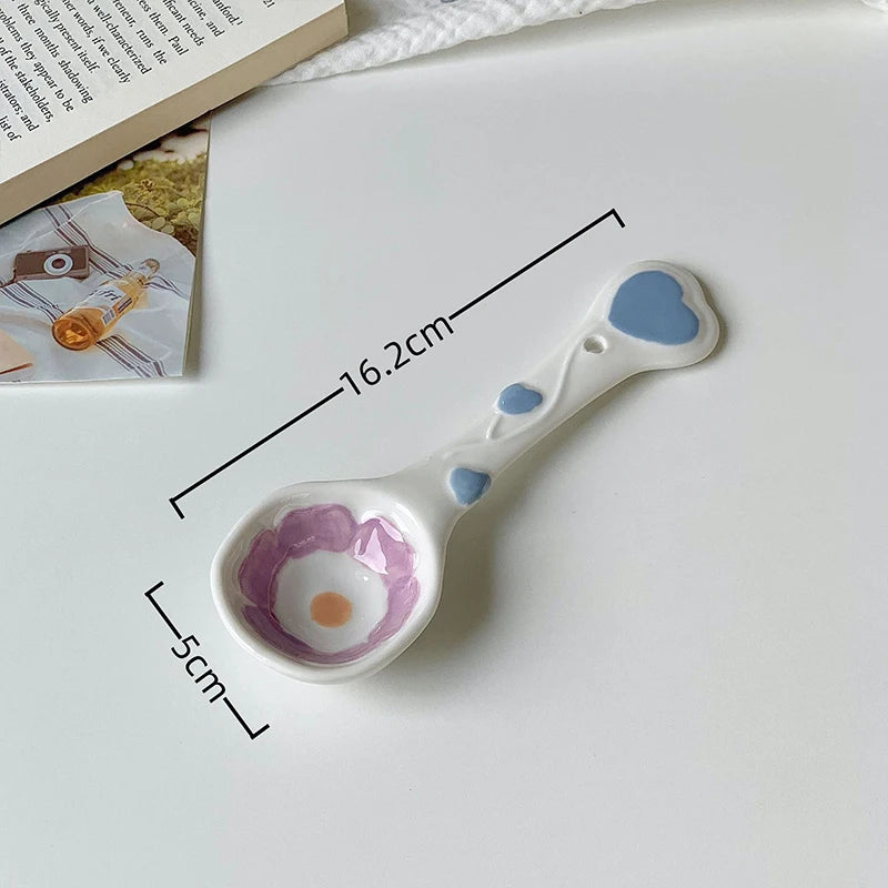 A white ceramic kawaii spoon on a table