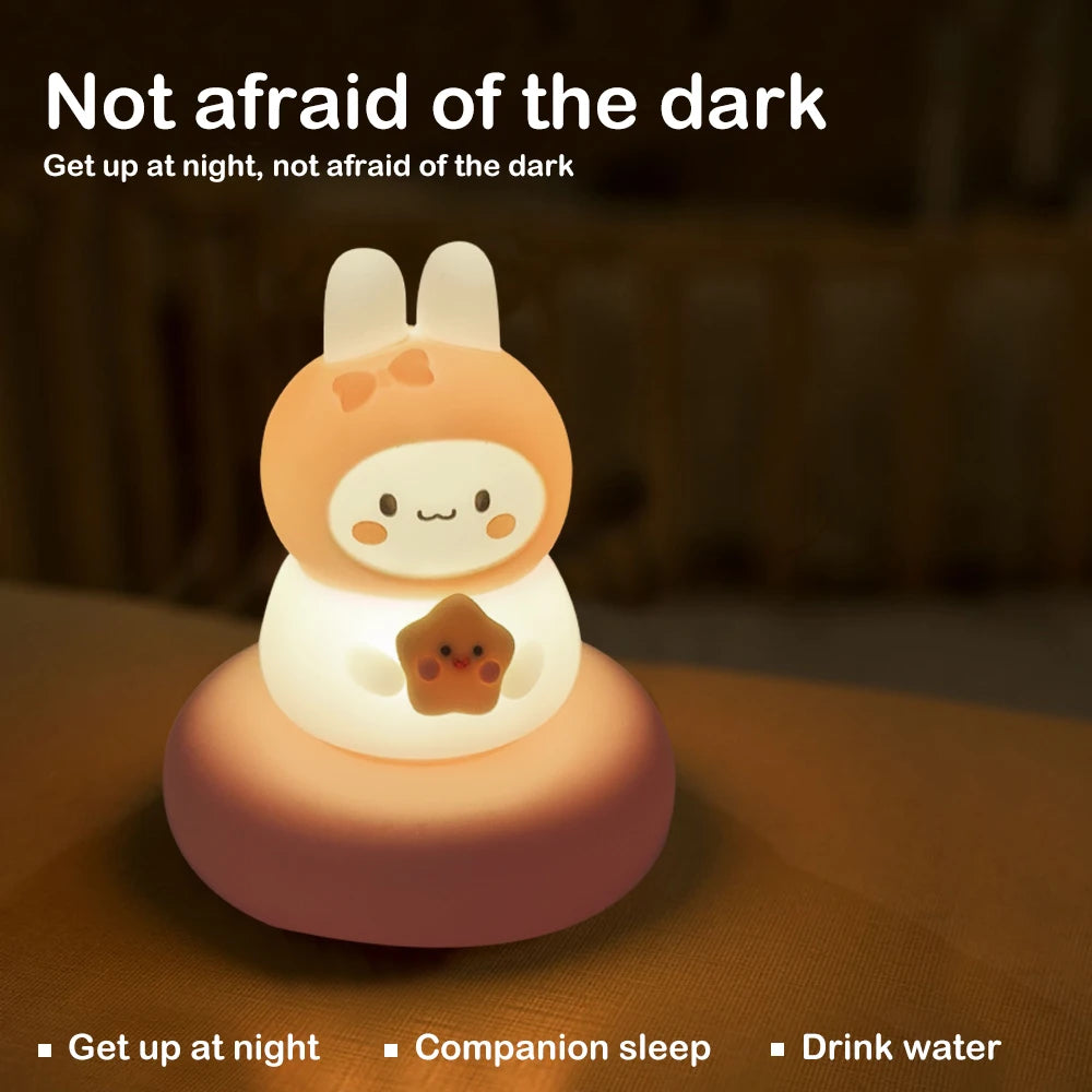 Cute kawaii cartoon character night light with text 'Not afraid of the dark' on a dark background