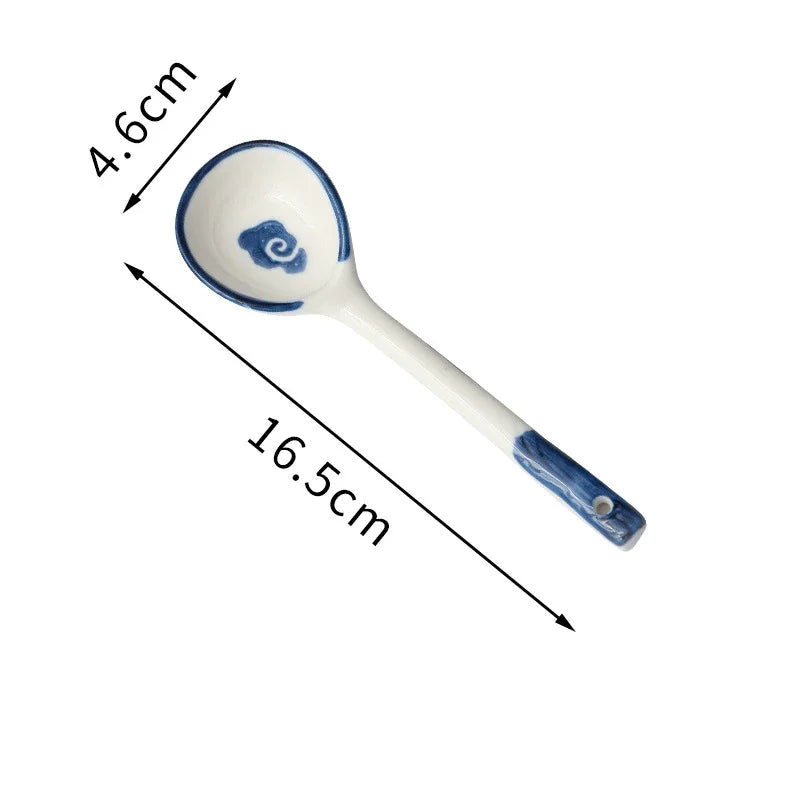 A blue and white kawaii spoon on a white background