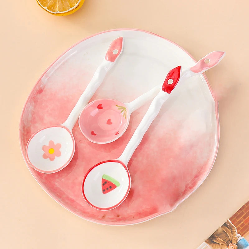 Three white kawaii spoons on a dinner plate