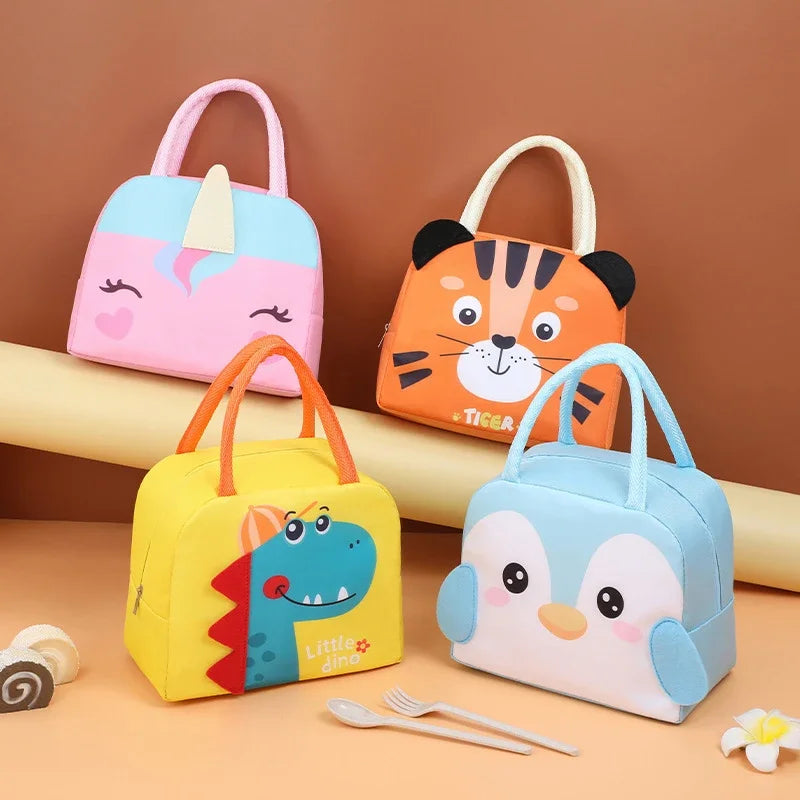 Four colorful children's kawaii lunch bags with animal designs on a brown background