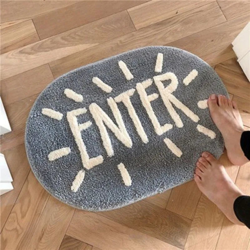 Kawaii gray rug with 'ENTER' text on a wooden floor