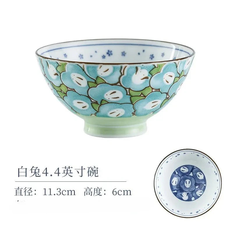 A kawaii bowl with a flower design on it against a white background