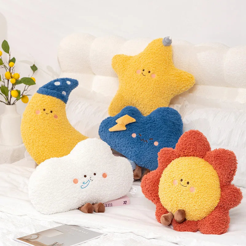 Set of colorful kawaii plush toys shaped like a moon, star, cloud, lightning bolt, and sun on a white surface.