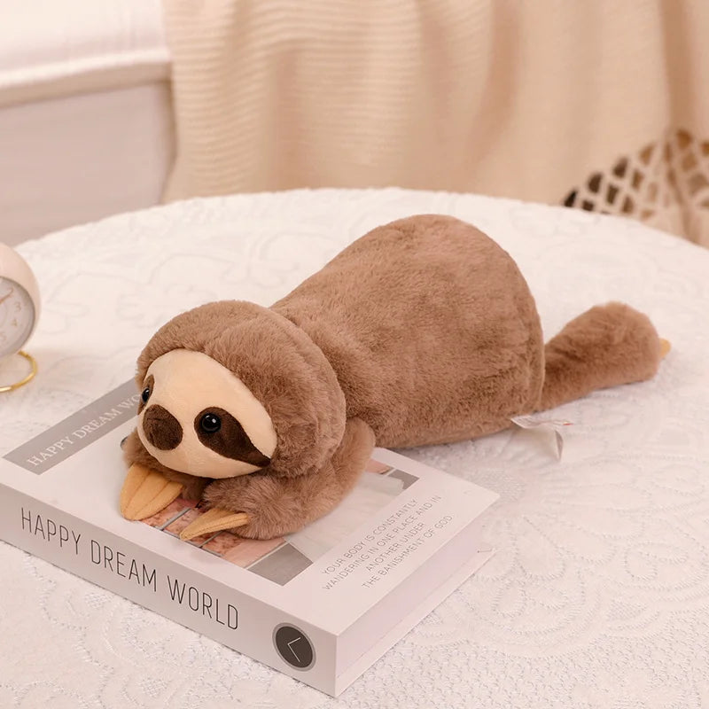 Kawaii plush sloth toy on a book with a soft background