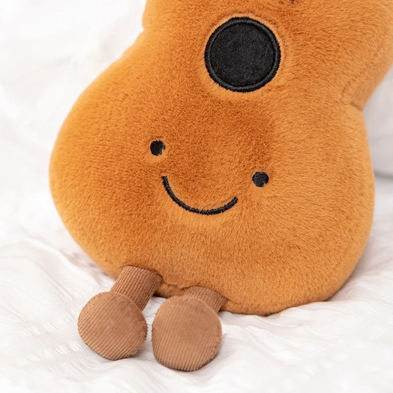 Kawaii plush toy shaped like a guitar with a smiling face on a white background