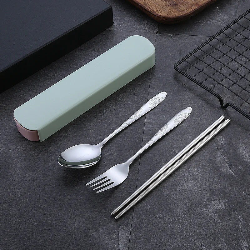Stainless steel kawaii utensils set with case on a dark surface