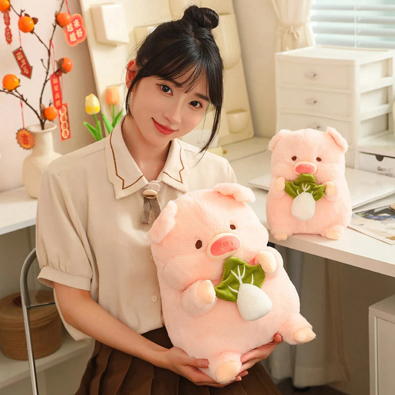 Woman holding a large pink kawaii plush pig toy in a home office setting.