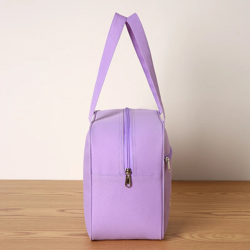 Purple kawaii bag with a strap on a wooden surface and light background
